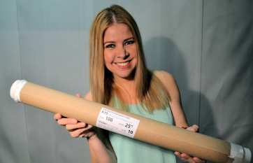 Julissa holding 10 yard roll of 106 25" Volan .73 oz fiberglass cloth from Thayercraft