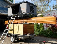 Canoe and trailer built using fiberglass cloth from Thayercraft