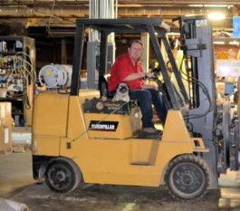 Steve Thayer on Cat forklift with Lola, Thayercraft Inc